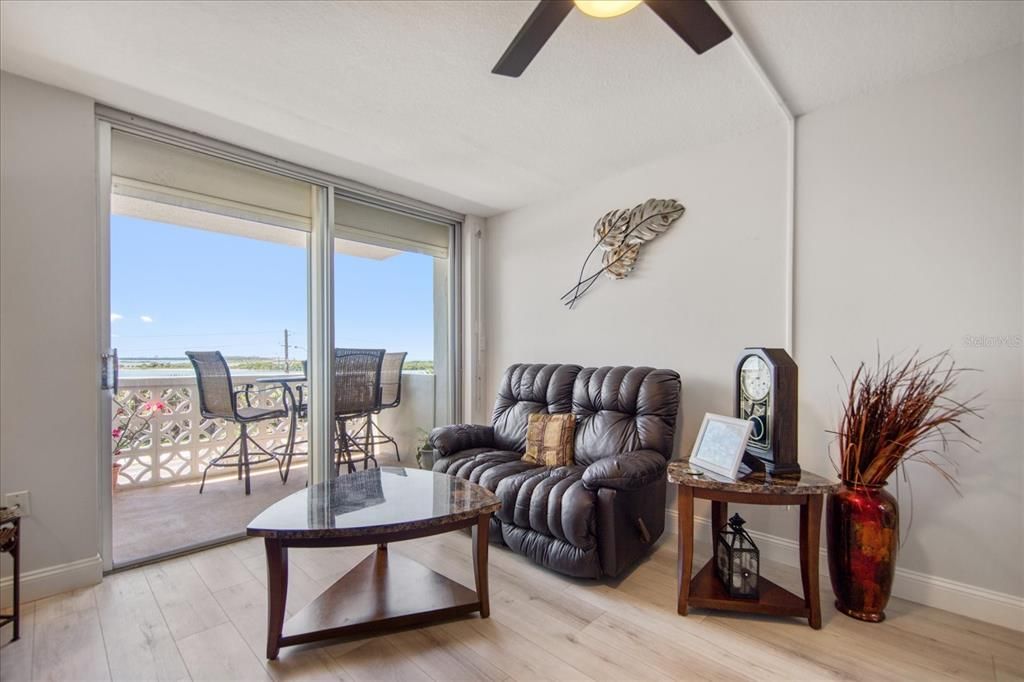 Waterfront living room that leads you out to your private 4th floor balcony. Plus hurricane shutters on the sliders!