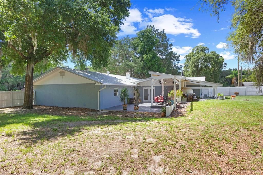 Large fenced yard with additional yard area outside of the fence