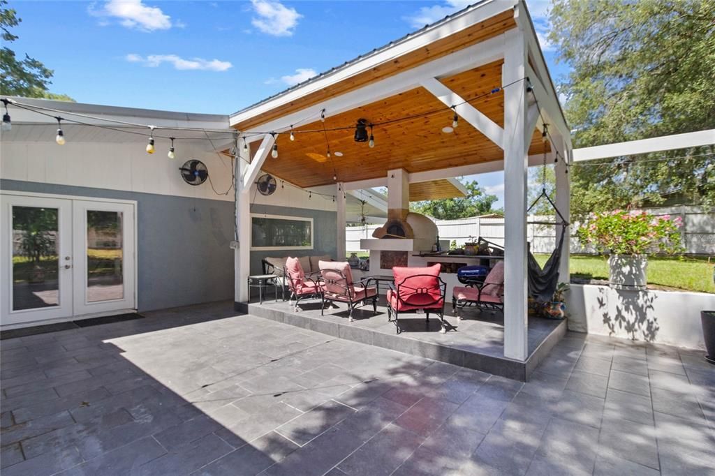 Large patio with pizza oven and granite counters