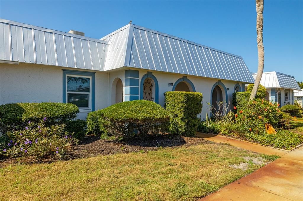 Located in a gated 55+ community, this building touts a new roof!