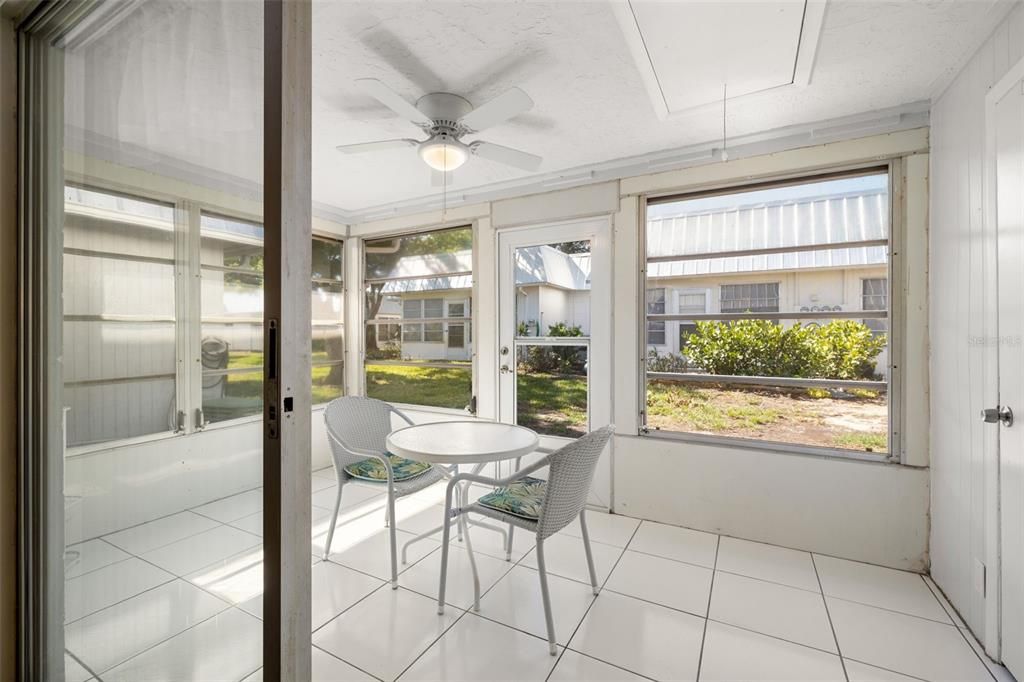 The enclosed lanai offers additional living space and storage. The lanai features a ceiling fan, windows, a storage closet as well as attic access.
