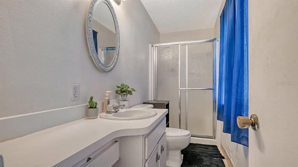 Owners ensuite bathroom featuring a walk-in shower.