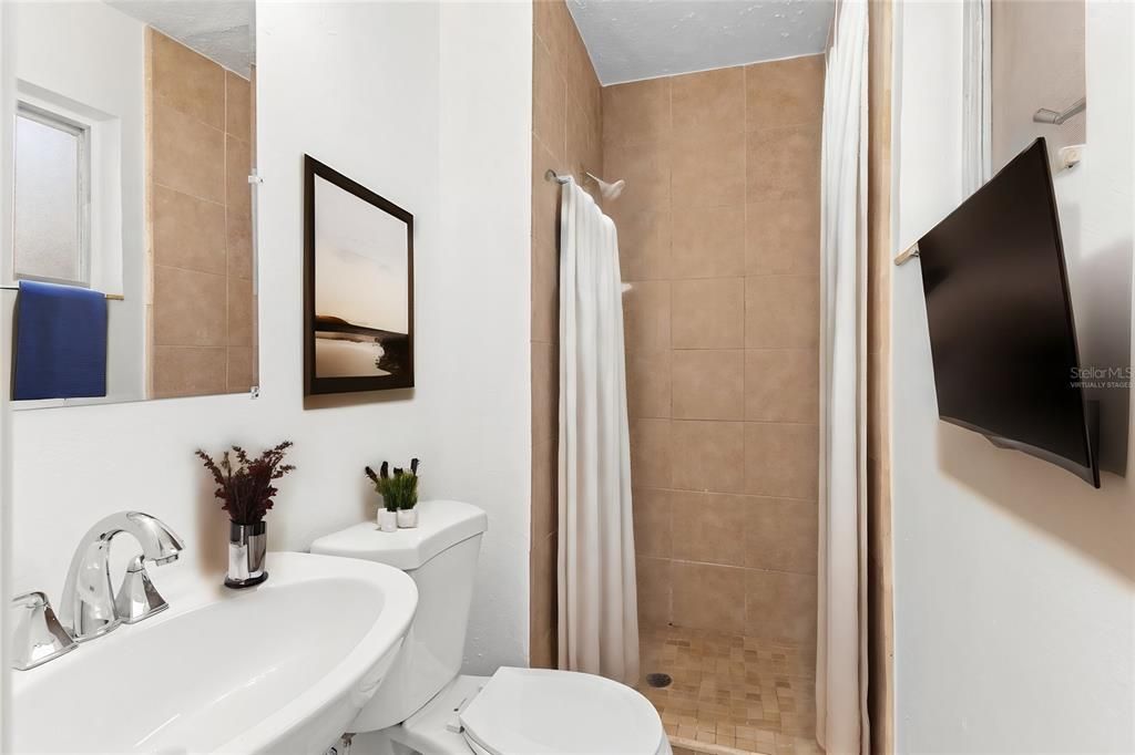 Virtually staged bathroom with walk-in shower