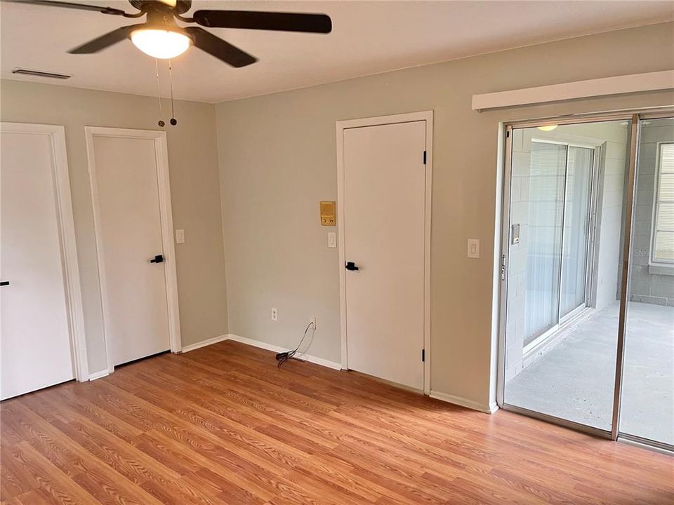 Master bedroom with sliding glass door to back porch