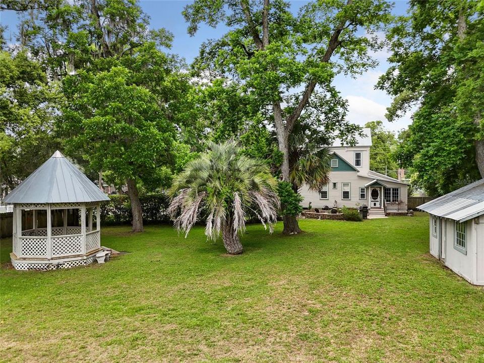 View of backyard with gazebo and shed