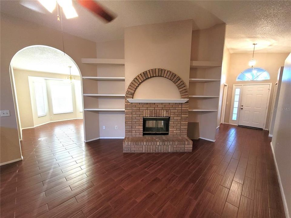 Living room with built in book cases and fireplace