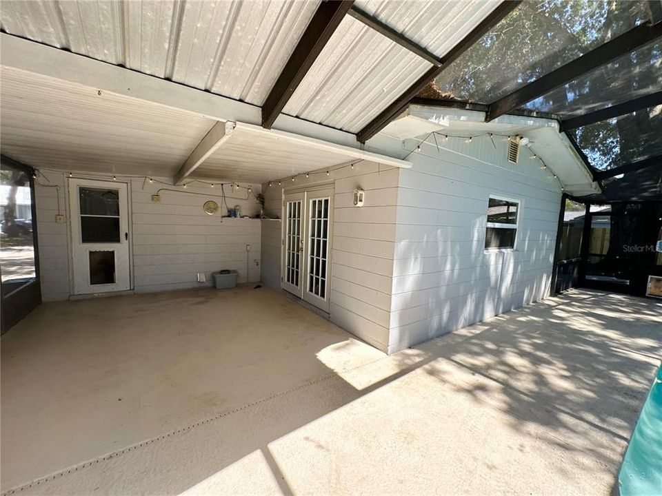 Back lanai with doors leading to laundry and family room