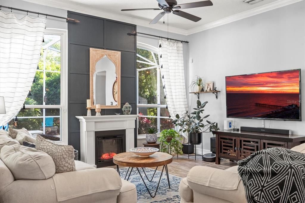 Family room with fireplace and accent wall.