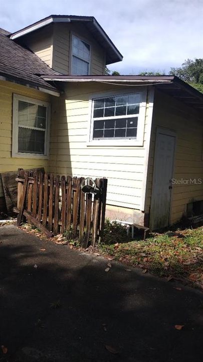 SIDE OF HOME NEAR DRIVEWAY FACING ORANGE ST.