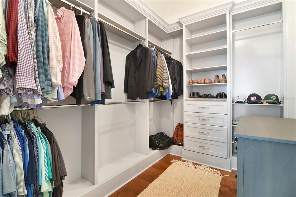 Custom built walk-in primary closet