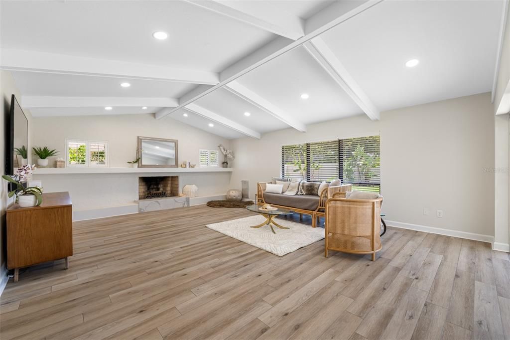 Vaulted ceilings with wood burning fireplace in the family room and ample space to create your own vision.