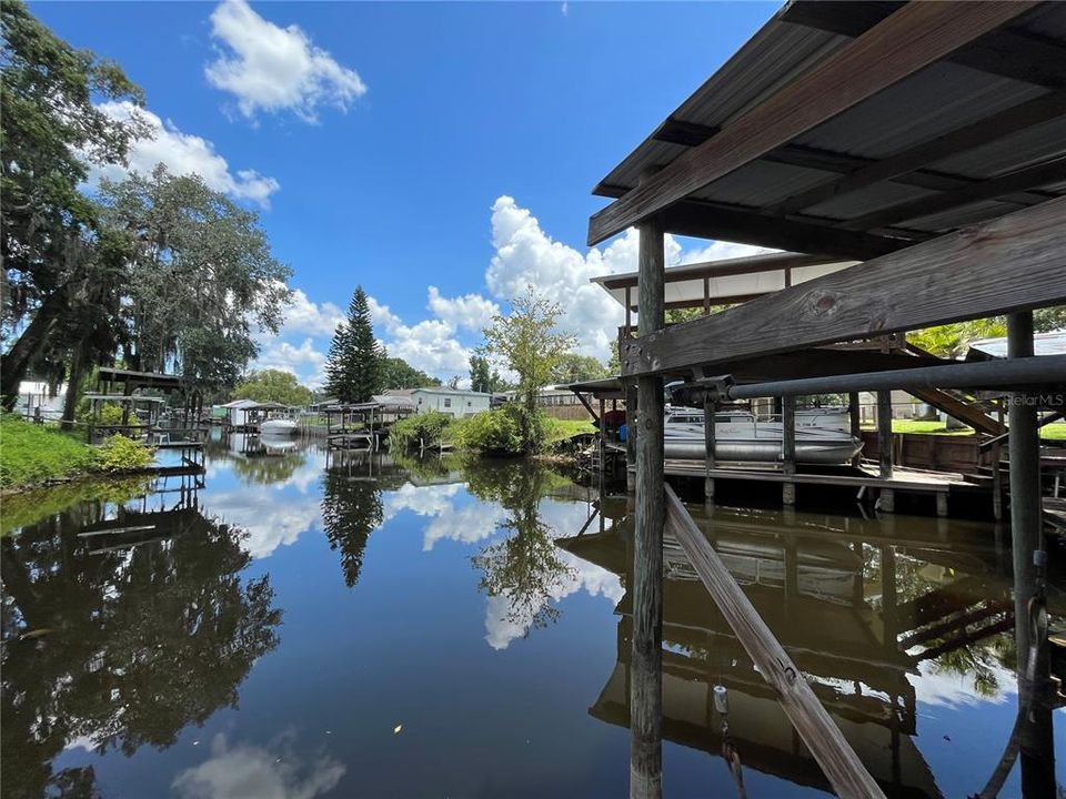 Canal to the St. John's River and side of boathouse.