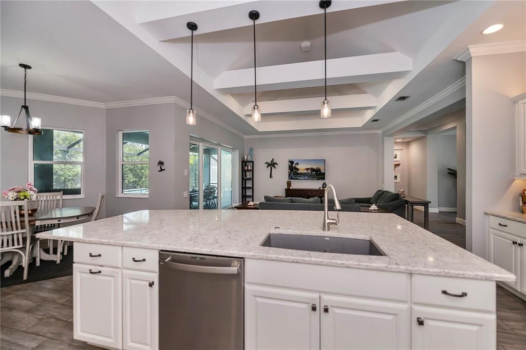 Soft close cabinetry with modern staggered upper cabinets featuring crown molding!