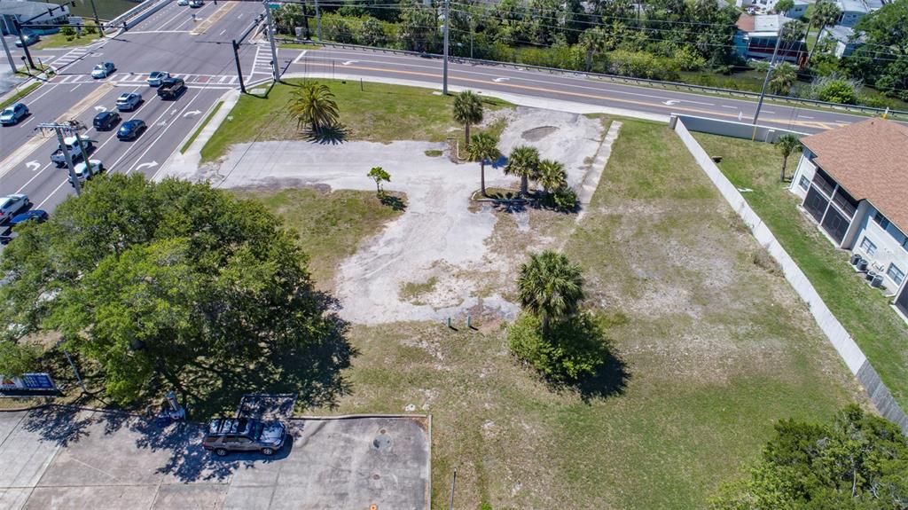 View of property, corner of Ridgewood, signal light and Reed Canal at top of photo.