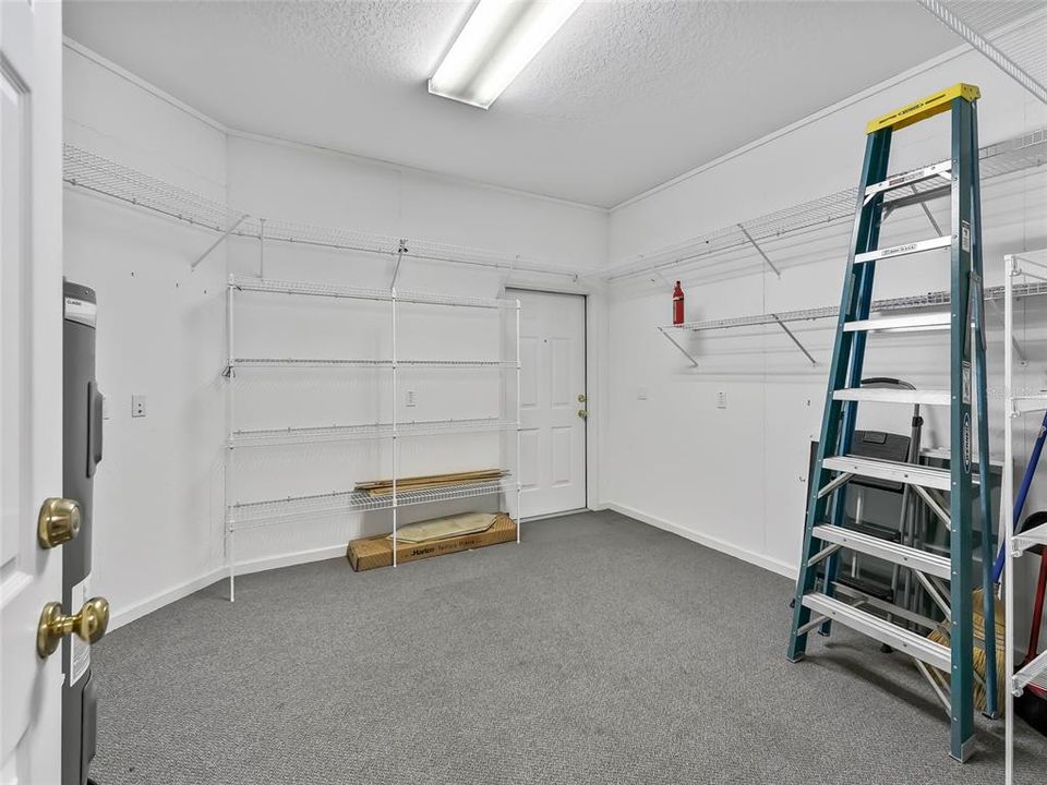 Climate-controlled extra storage room accessed from the garage