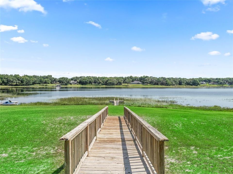 Picture showing close view of bridge and looking toward dock and lake