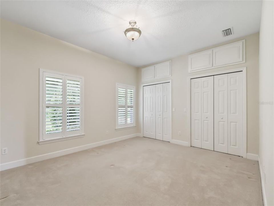 Front guest bedroom.  Note the double closets with extra storage above.