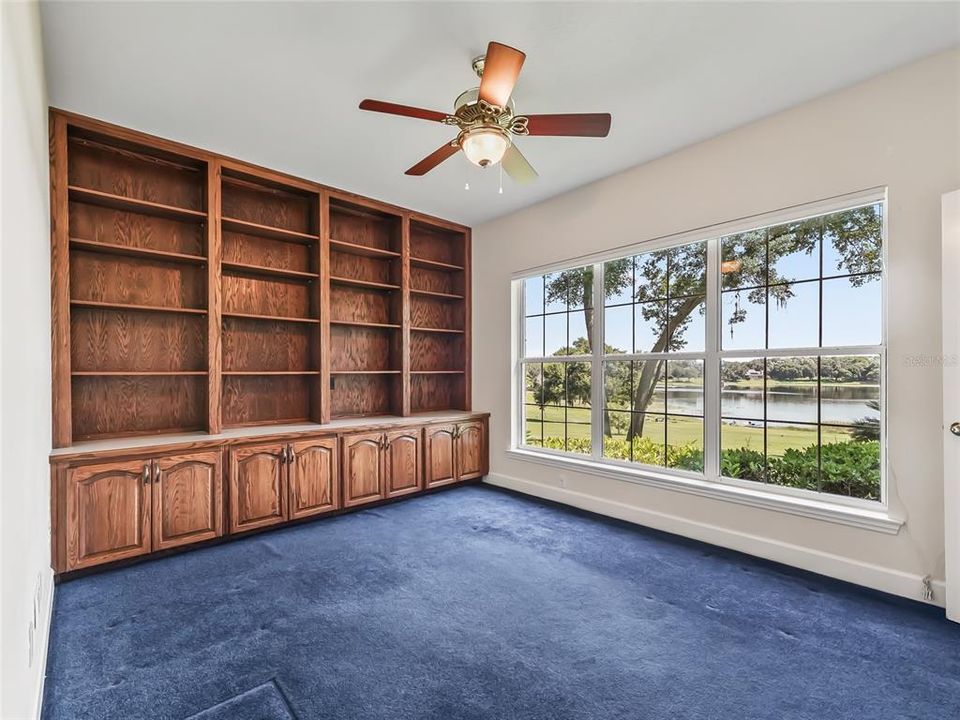 Separate study with built in bookcases and picture window with lake views.