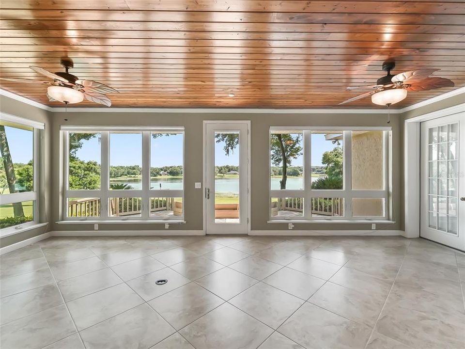 Sunroom with plenty of windows for lake viewing.  Note the pine tongue and groove ceiling.