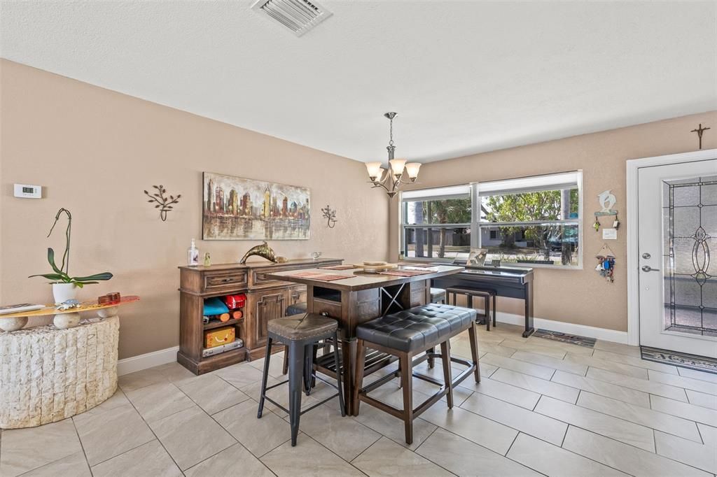 Open floor plan with kitchen as central