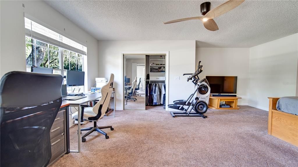 Master Bedroom w/ screened door connects to lanai/backyard