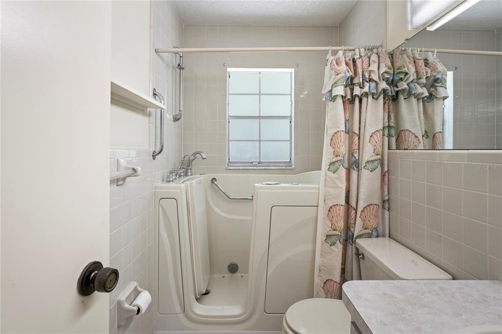 Guest bedroom has the built in tub