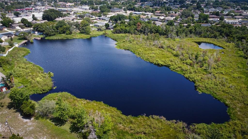 Lake behind house, lot does not extend to lake, making it "lake front", however it is accessible via the easement