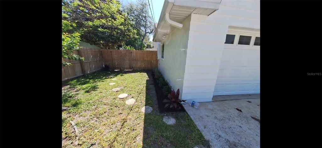 Stone path from driveway to backyard