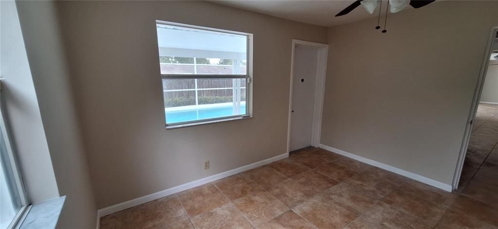 Bedroom 2 with ceiling fan and closet