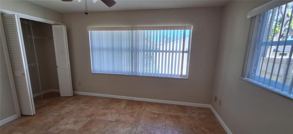 Bedroom 3 with ceiling fan and big closet