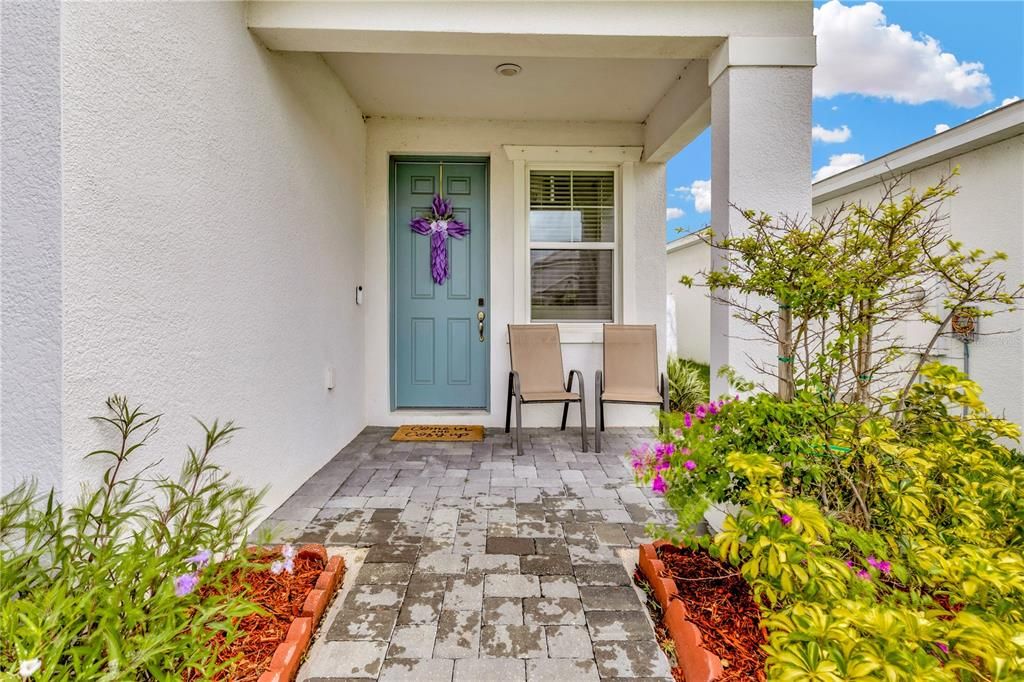 Lovely entrance with pavers and new plantings