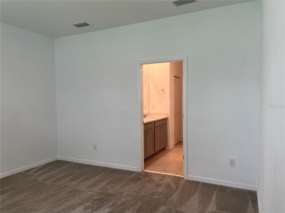 Inside laundry room with storage shelves