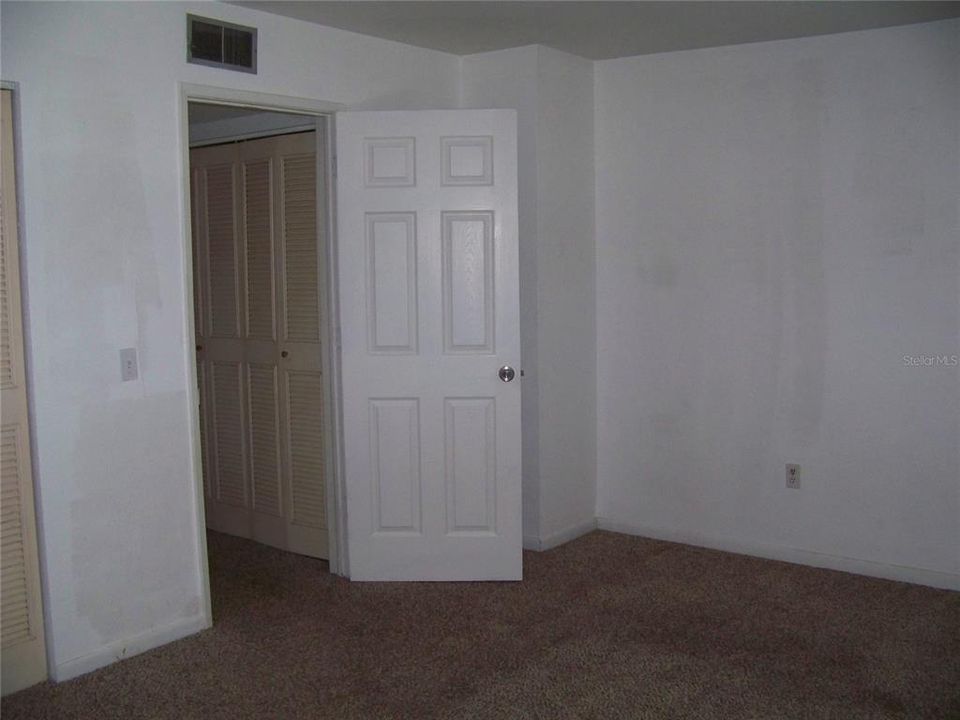 Primary bedroom- bath behind you, entrance door ahead