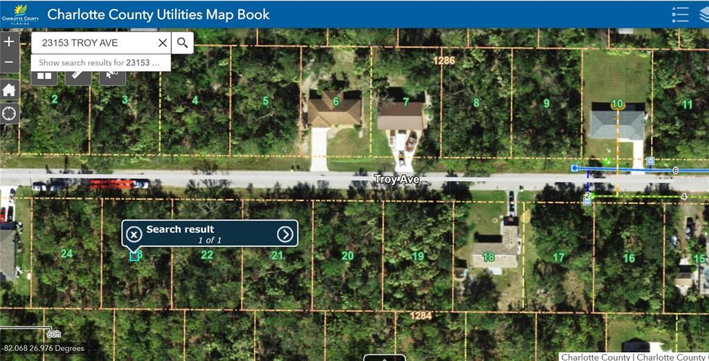 Photo taken from Charlotte County GIS.  Note: to the right you will see a blue and green lines. Public  water “blue” and public sewer “green” is seven or eight lots away.  Buyer and buyers agent to verify Public utilities availability to their own satisfaction.