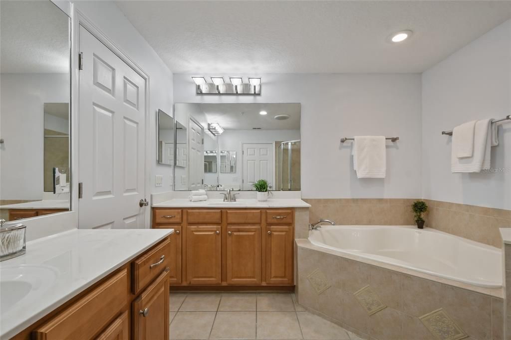 Master bathroom featuring double vanities