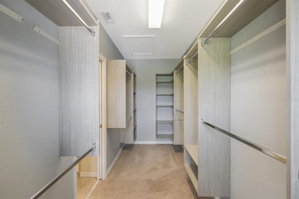 Updated walk-in closet with shelving and flexible hanging system