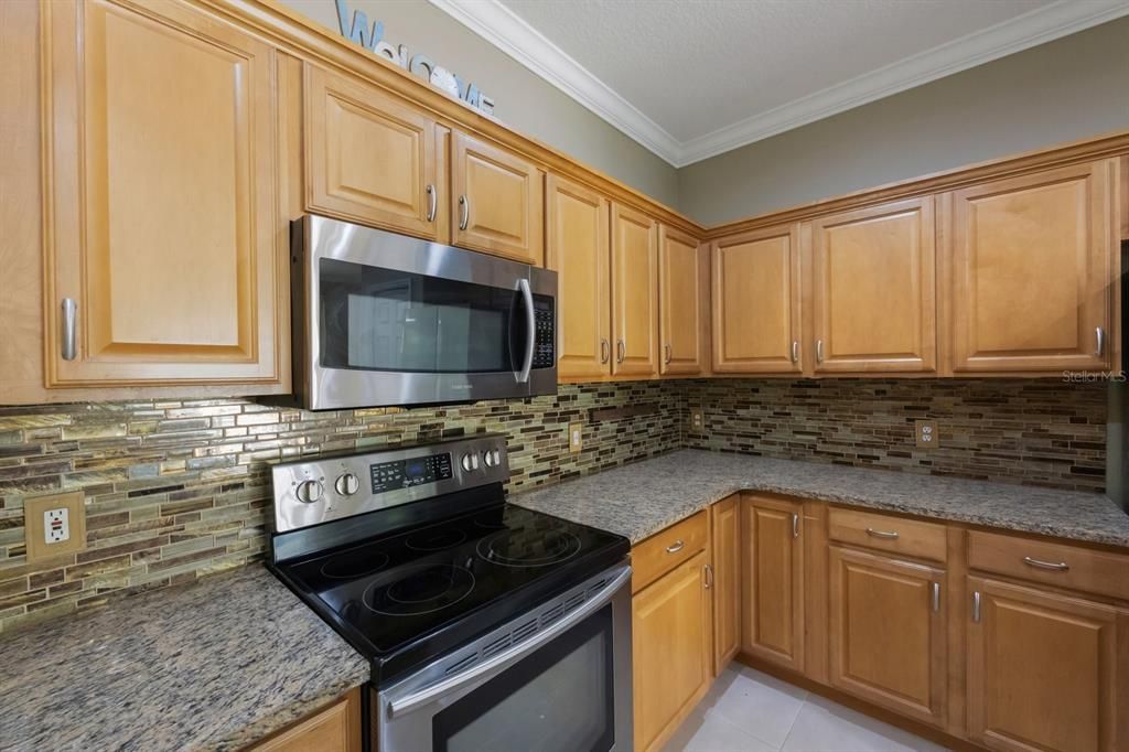 Wood cabinets and tile back splash