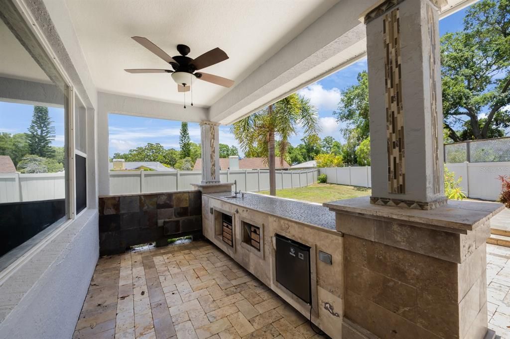 Covered bar with sink and mini refrigerator