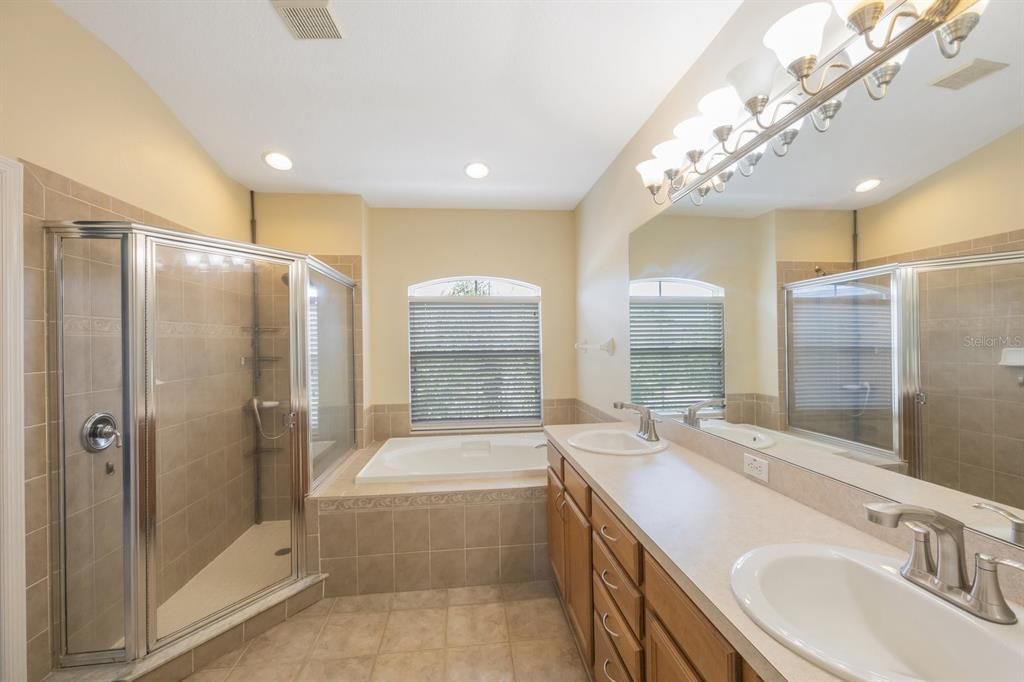 Separate shower and garden tub, dual sinks