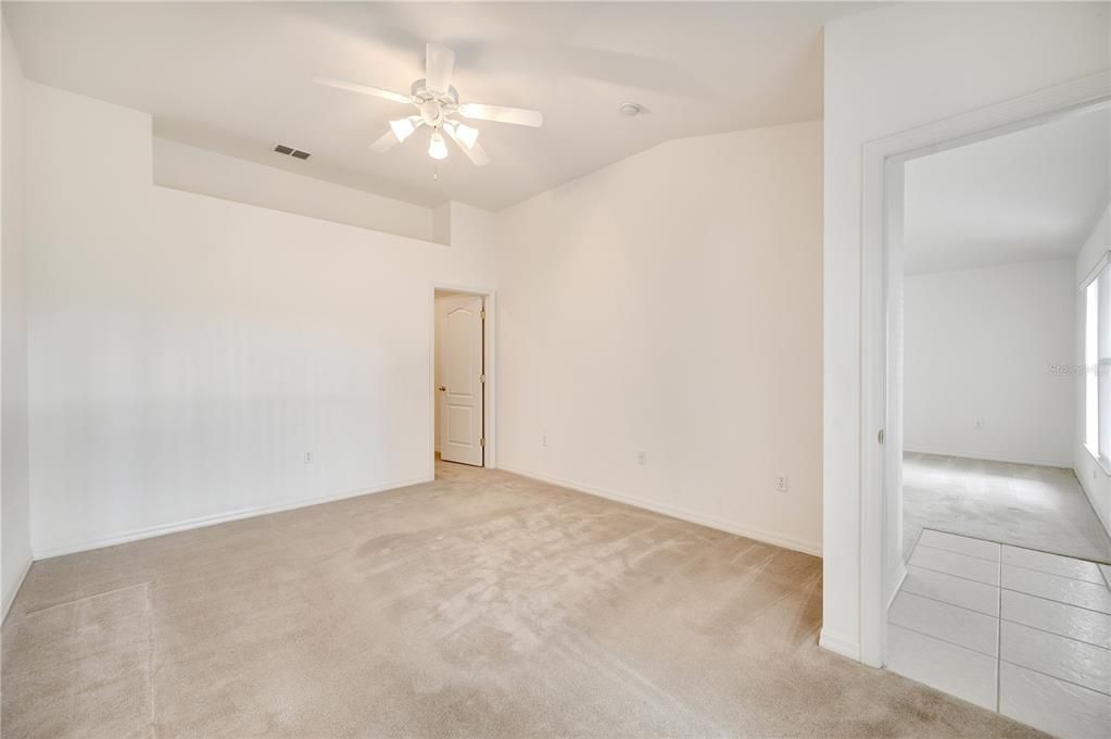 Master Bedroom with door leading to walk in closet