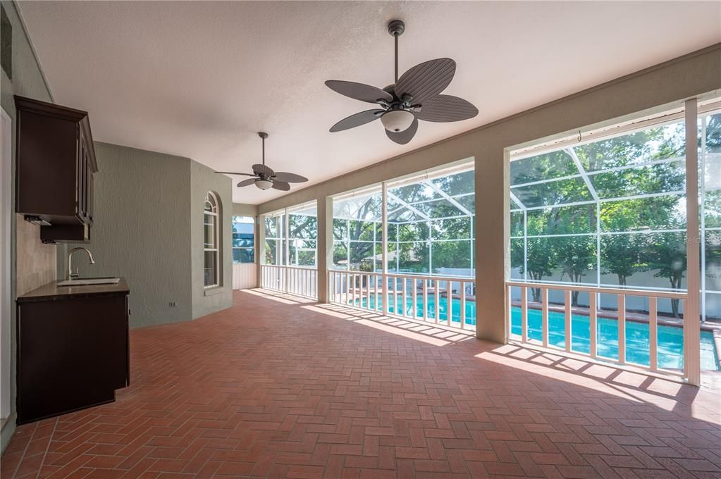 Gorgeous screened lanai overlooking the sparkling pool below