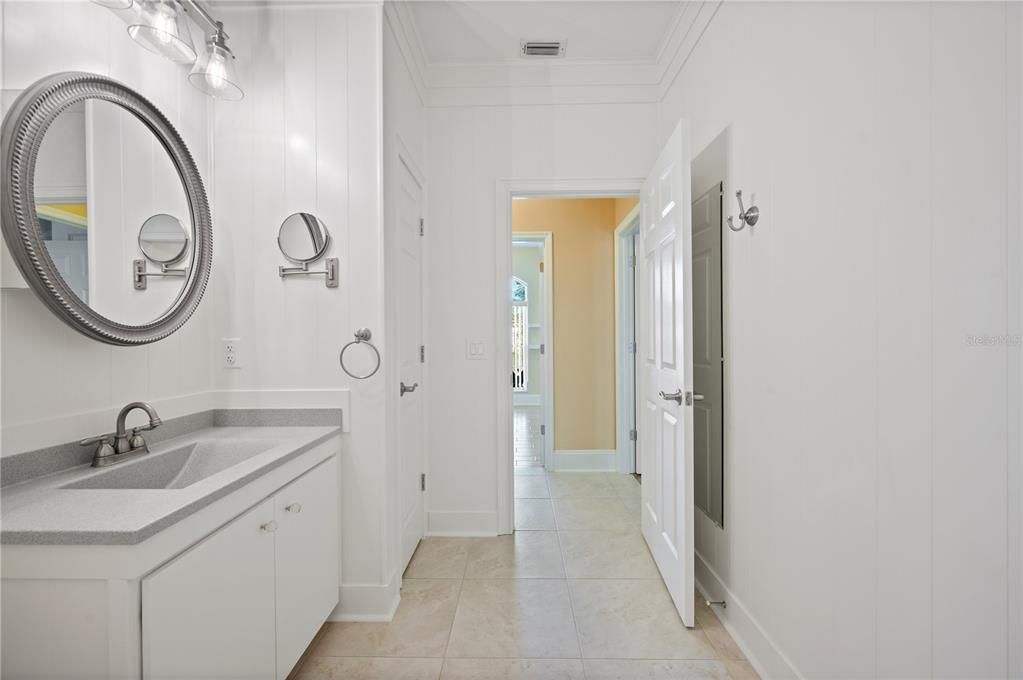 Hall Bath 1 with access to the screened in lanai and pool area