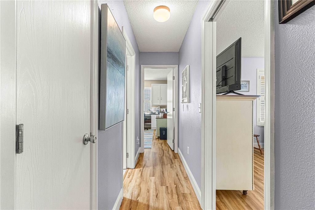 The Hallway on the Guest Side of The Home with a Pocket Door Allowing Privacy for Visitors