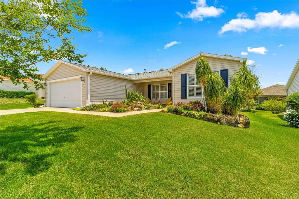 Beautifully Landscaped Gardens and Lush Green Lawn