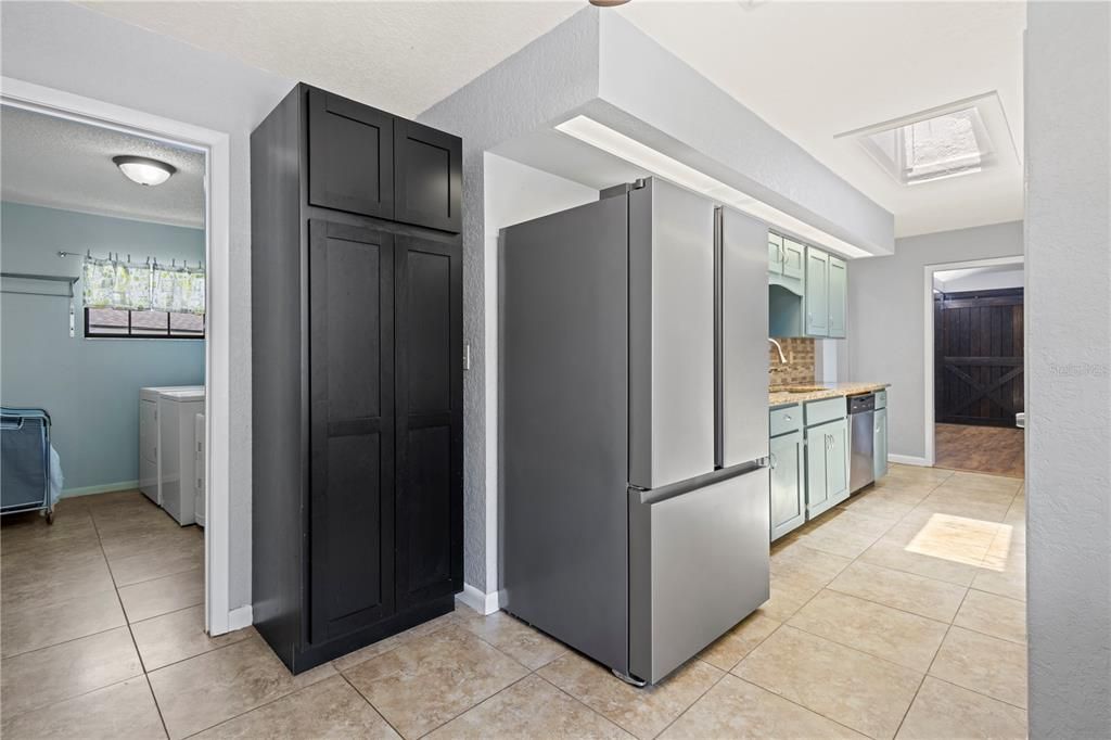 View of laundry room from breakfast nook in kitchen