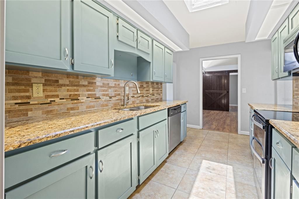 Kitchen with view of bonus room entrance