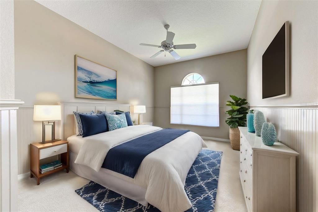 Virtually staged 2nd bedroom.  Private, light and airy - guests will feel right at home.