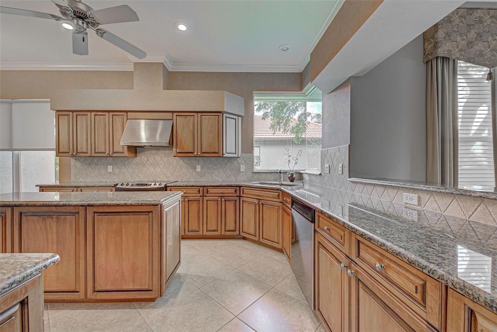 Gourmet kitchen will delight the chef in the family.    You will love the large island and the aquarium window which lets the natural sunlight stream in.