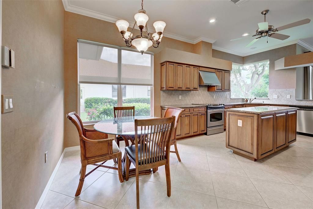 Sunny breakfast nook, just off the kitchen is the perfect place for a casual meal.