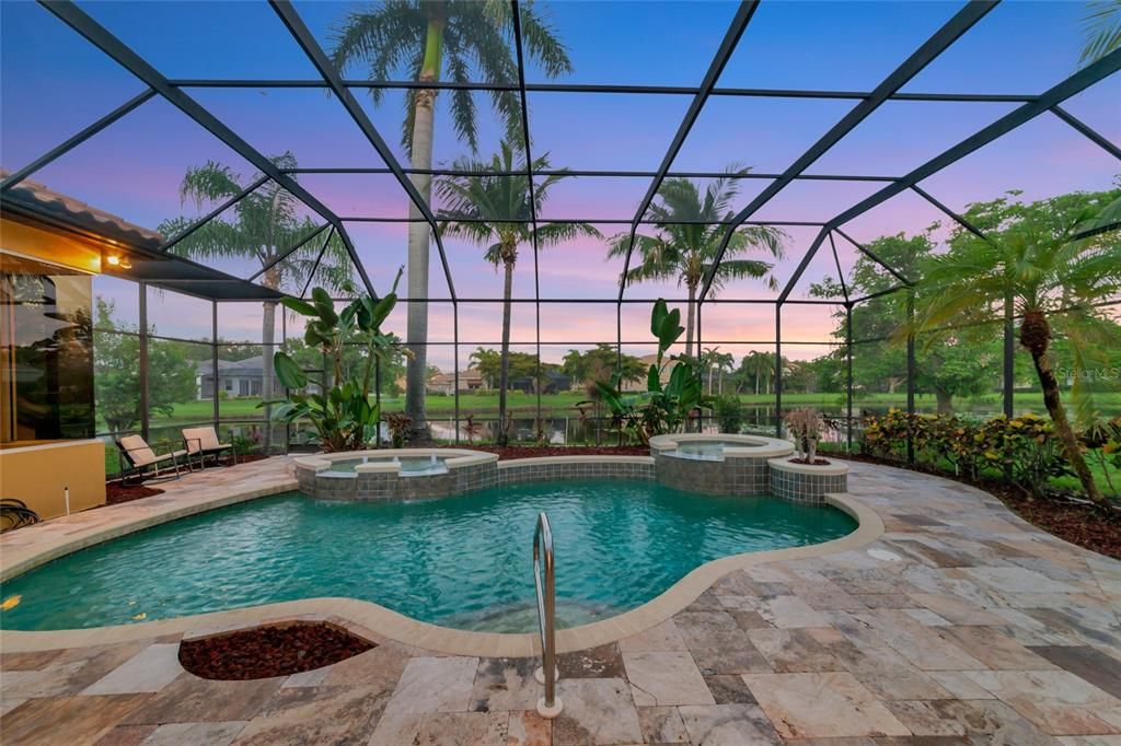 Pool at twilight overlooking tranquil lake.